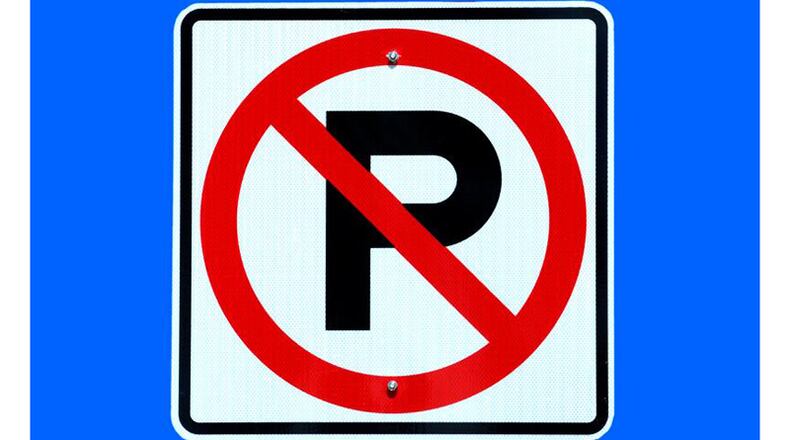 Milton has adopted a local parking ordinance that its police chief says may lead to lower fines for violators. AJC FILE