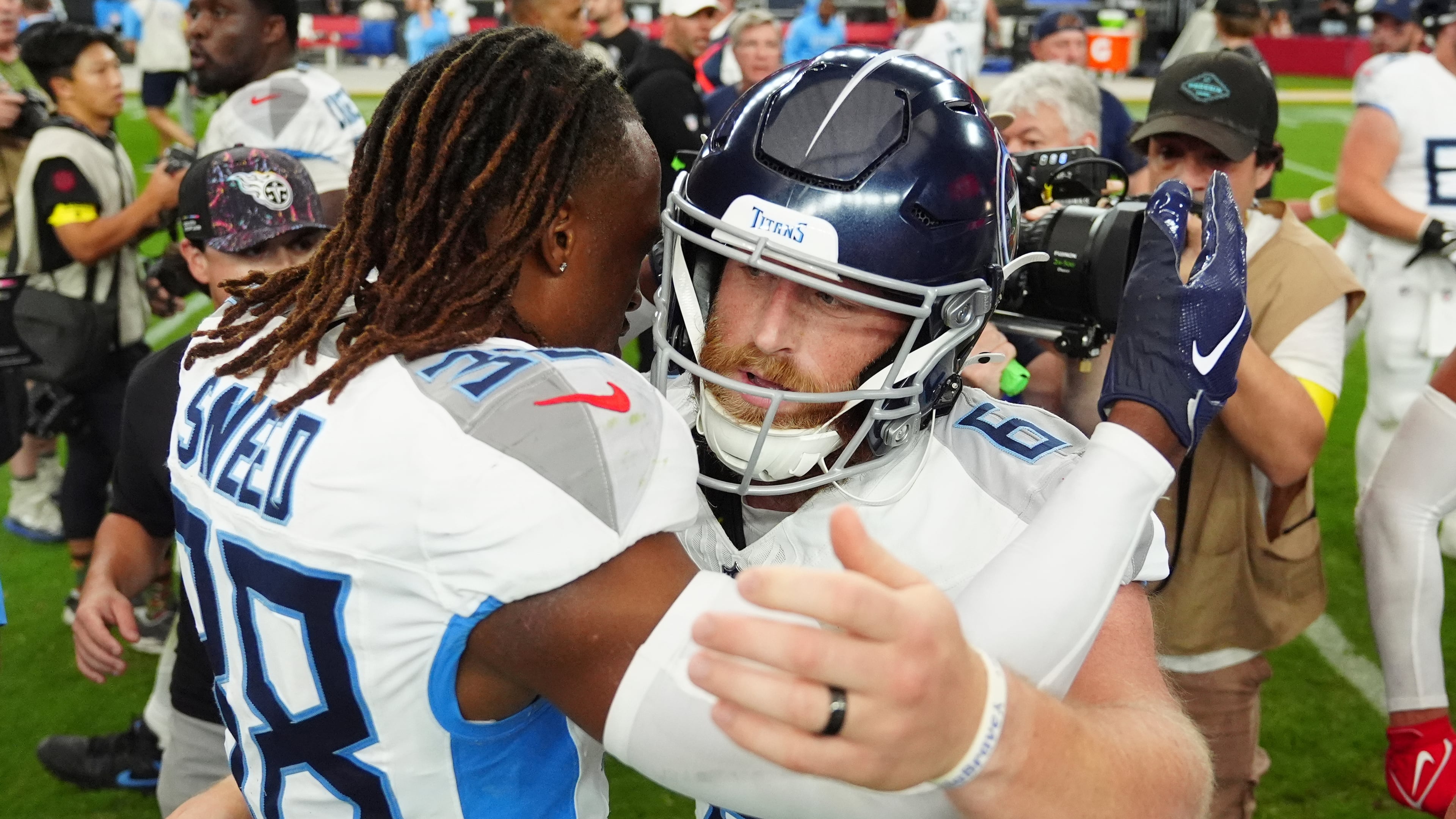 Tennessee Titans cornerback L'Jarius Sneed (38) congratulates place-kicker Joey Slye (6) after kicking the game winning field goal in an NFL football game against the Arizona Cardinals, Sunday, Oct. 5, 2025, in Glendale, Ariz. (AP Photo/Ross D. Franklin)