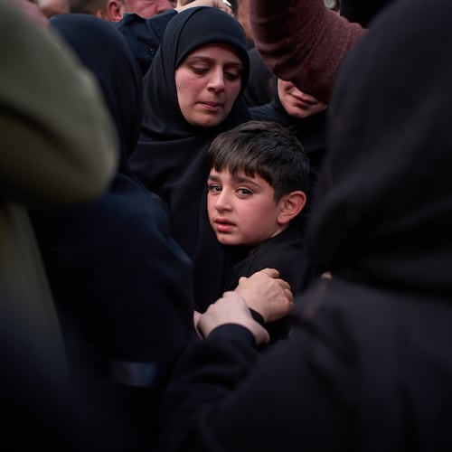 Mohammed, 8, cries next to the coffin of his father, Hussein Makkah, during the funeral of 13 state security officers killed the previous day in an Israeli strike in Lebanon’s coastal city of Sidon, Lebanon, Saturday, April 11, 2026. (AP Photo/Emilio Morenatti)