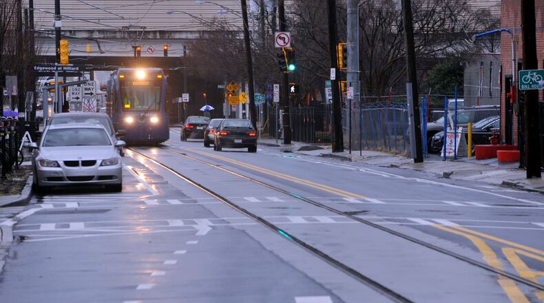 JANUARY 2, 2015 ATLANTA The Atlanta Streetcar makes its way along Edgewood Ave in Atlanta, Friday, January 2, 2015. Jordan is one of those business owners who said his sales took a hit during construction of the streetcar line because it blocked traffic and generally made it dusty and difficult to come to his shop. Businesses along Atlanta's new streetcar line are hopeful that it will bring a stream of new customers, but they're also relieved that months of construction-related stress on their firms has finally come to an end. Some wonder if it will ultimately be worth the cost. KENT D. JOHNSON/ KDJOHNSON@AJC.COM It's no mind trick: This is not the streetcar you're looking for. (AJC Photo / Kent D. Johnson)