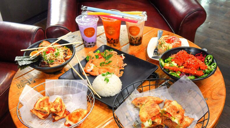 A few of the offerings available at Sweet Octopus (Clockwise from bottom right): Empanadas from Empanada House, Sweet Empanadas from Empanada House, Village Classic from Lifting Noodles Ramen, Taro, Thai Tea and Brown Sugar Bubble Teas from Empanada House, Donut from Poke Burri, Dynamite Bowl from Poke Burri and Red Curry Chicken and Shrimp (Thai Food). CONTRIBUTED BY CHRIS HUNT PHOTOGRAPHY