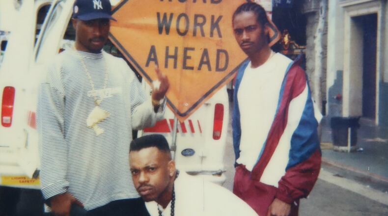 This undated photo provided by Maurice "Mopreme" Shakur on Wednesday, July 22, 2026, shows, from left, Tupac Shakur, Mike Cooley, and Mopreme Shakur, posing for a photo in Los Angeles. (Mopreme Shakur via AP)