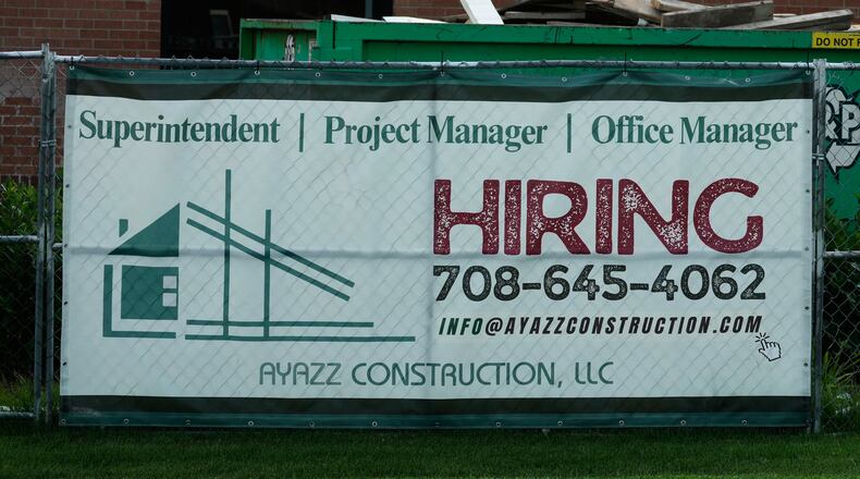 A hiring sign is seen in Buffalo Grove, Ill., Thursday, June 25, 2026. (AP Photo/Nam Y. Huh)