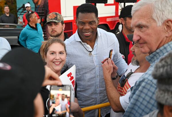 Then-Republican U.S. Senate hopeful Herschel Walker greets his supporters during a 2022 rally in Smyrna. (Hyosub Shin/AJC)