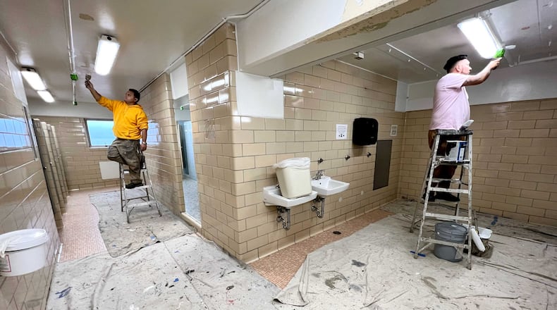 Crews work to scrape, prime and paint ceilings with mold-inhibiting scrubbable paint at Mell Hall at the University of Georgia. (Courtesy of University of Georgia)