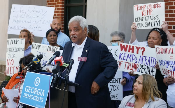 State Rep. Roger Bruce, D-Atlanta, spoke at a news conference outside a gun store in 2022. He retired last year.