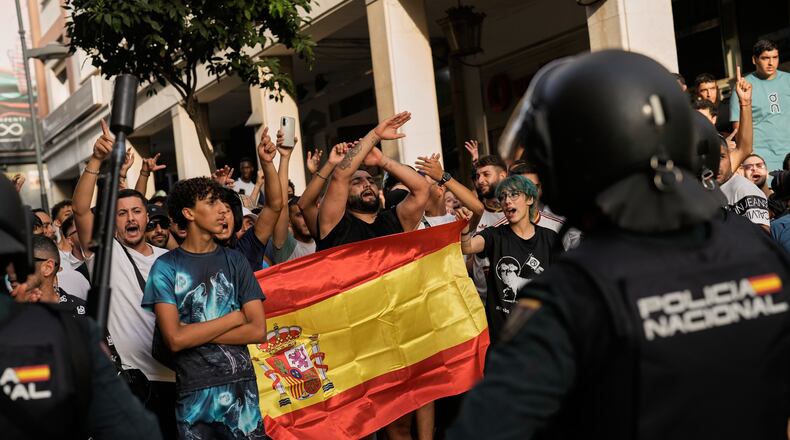 Ceuta residents demonstrate against the arrival of Spanish far-right politician Alvise Pérez in the Spanish enclave of Ceuta, Saturday, Aug. 1, 2026. (AP Photo/Bernat Armangue)