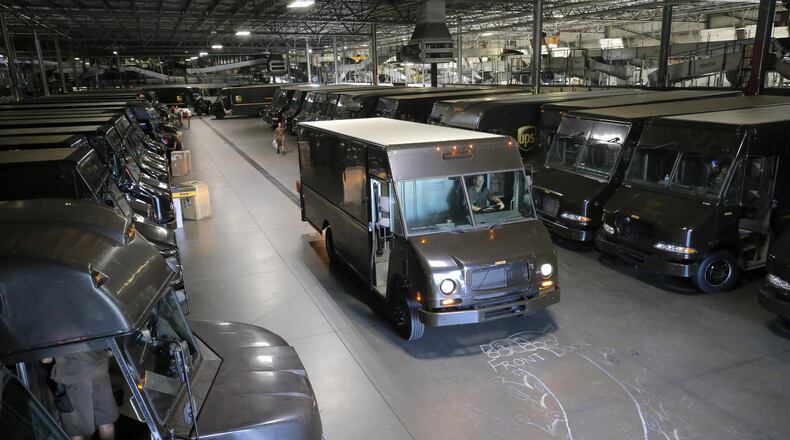 UPS drivers head en masse to their routes. BOB ANDRES /BANDRES@AJC.COM