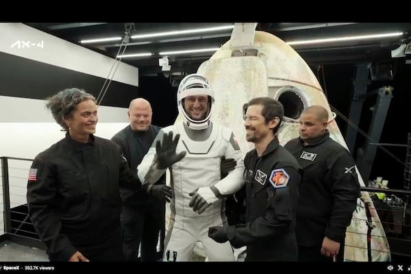 In this image made from video provided by SpaceX, one of the four astronauts, Poland's Slawosz Uznanski-Wisniewski, comes out of a SpaceX capsule loaded at the recovery ship after parachuting into the Pacific Ocean off the coast of Southern California on Tuesday, July 15, 2025. (SpaceX via AP)