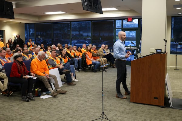 Dunwoody resident Jason Hunyar speaks to the Dunwoody’s City Council during a public portion of their meeting at Dunwoody City Hall in February. Hunyar spoke in opposition of the city potentially using Flock, a license plate reader company. (Jason Getz/AJC)
