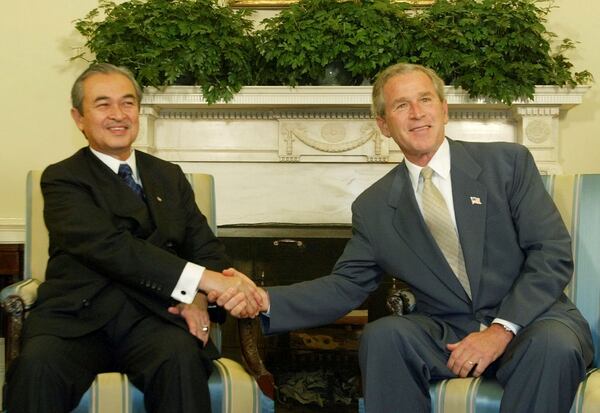FILE - President George W. Bush, right, greets Malaysian Prime Minister Abdullah Ahmad Badawi in the Oval Office of the White House, Monday, July 19, 2004, in Washington. (AP Photo/Pablo Martinez Monsivais, File)