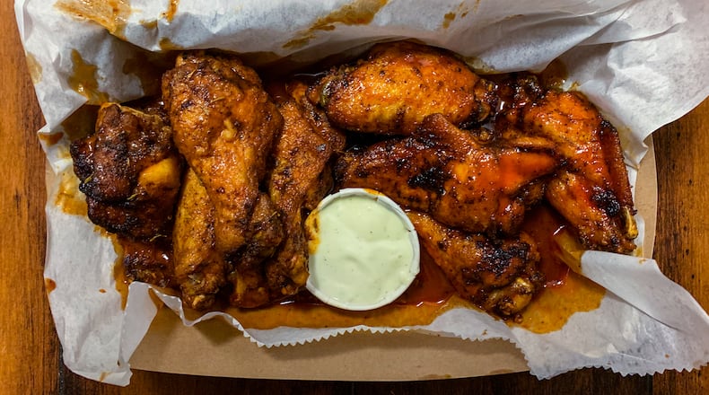 The Local has three sections on its menu: wings, hot dogs and tacos. The wings take top billing for a reason.