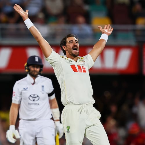 Australia's Mitchell Starc appeals successfully for the wicket of England's Joe Root, left, during the second Ashes cricket test match between Australia and England in Brisbane, Saturday, Dec. 6, 2025.. (AP Photo/Tertius Pickard)