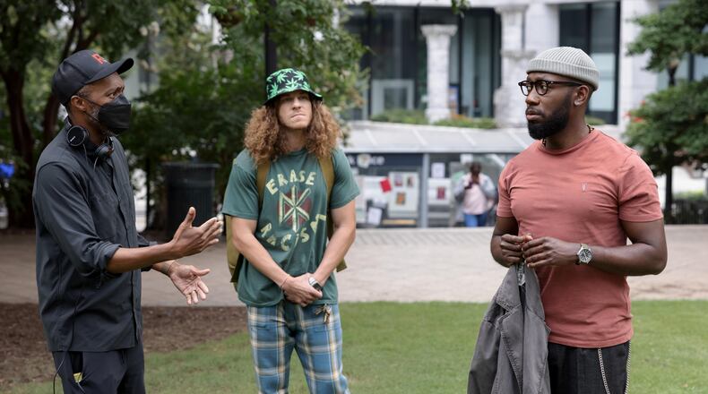 After a year of rising as a prominent activist, Keef draws a strip that sparks a protest headlined by him. But can he live up to his new platform? Director Maurice Marable, Gunther (Blake Anderson) and Keef Knight (Lamorne Morris), shown in downtown Atlanta, pretending to be San Francisco. (Photo by: Steve Swisher/Hulu)