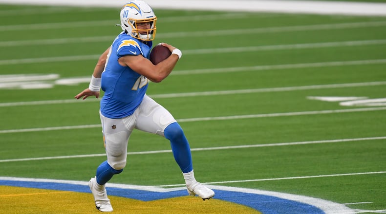 Los Angeles Chargers quarterback Justin Herbert (10) sprints with the ball against the New York Jets Sunday, Nov. 22, 2020, in Inglewood, Calif. (AP Photo/Kyusung Gong)
