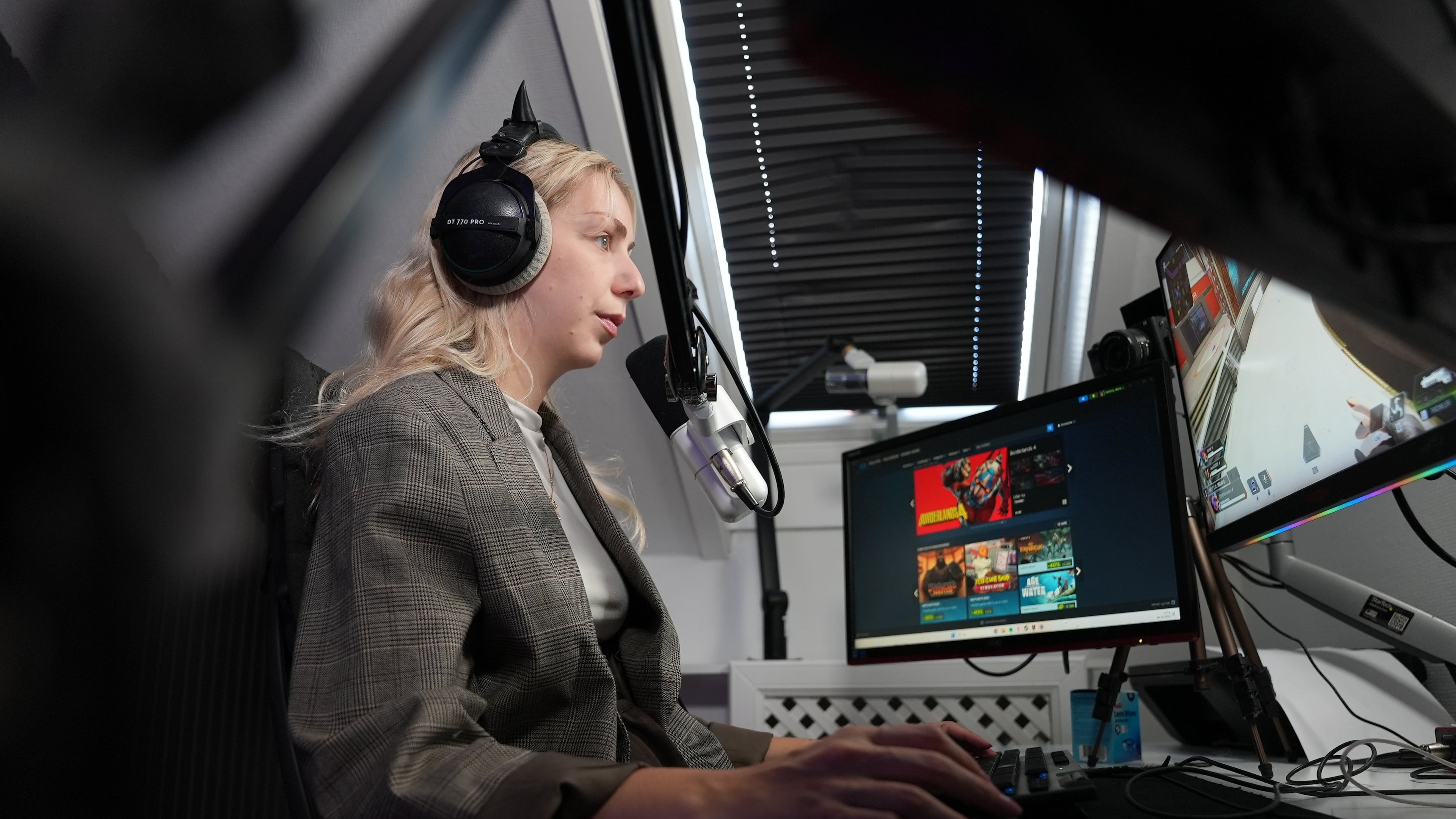 Danish video game live-streamer Marie Watson, 28, plays a video game in her studio in Taastrup, Denmark, Thursday, Oct. 9, 2025. (AP Photo/James Brooks)