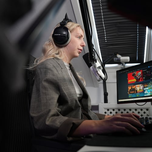 Danish video game live-streamer Marie Watson, 28, plays a video game in her studio in Taastrup, Denmark, Thursday, Oct. 9, 2025. (AP Photo/James Brooks)