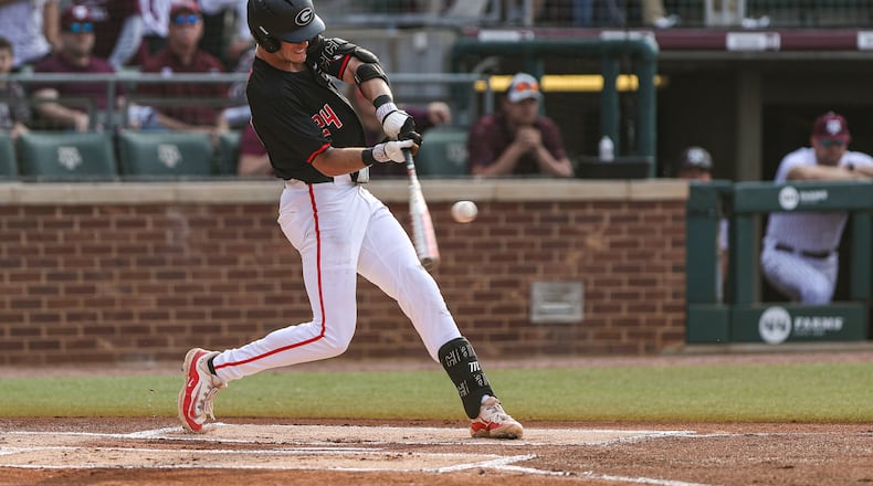 Georgia first baseman and outfielder Charlie Condon (24) connects on his first of three home runs against Texas A&M at Blue Bell Park in College Station, Texas, this past weekend. Condon became the Bulldogs' single-season (29) and career (54) home run leader.  (Kari Hodges/UGA Athletics)