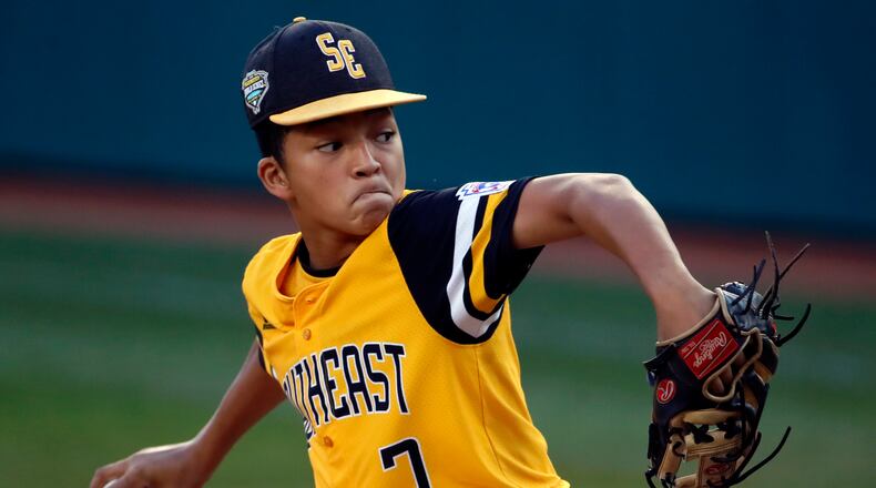 Peachtree City, Georgia's Tai Peete delivers in the first inning against Staten Island (N.Y.) at the Little League World Series baseball tournament in South Williamsport, Pa., Thursday, Aug. 23, 2018. (AP Photo/Gene J. Puskar)