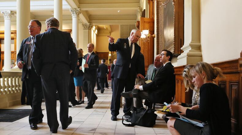 Feb. 29, 2016 - Atlanta - Lobbyists in the hallways follow the day's activity. Many key bills come up for last-chance votes Monday on crossover day at the Capitol. Crossover Day is the final day for a bill to move from one chamber to the other this year. Although there are ways around the rule, only a few bills each year successfully defy Crossover Day's deadline. BOB ANDRES / BANDRES@AJC.COM