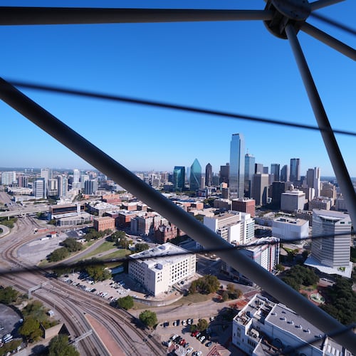 FILE - The Dallas skyline is visible through the framing of Reunion Tower, Nov. 6, 2025, in Dallas. (AP Photo/Julio Cortez, File)