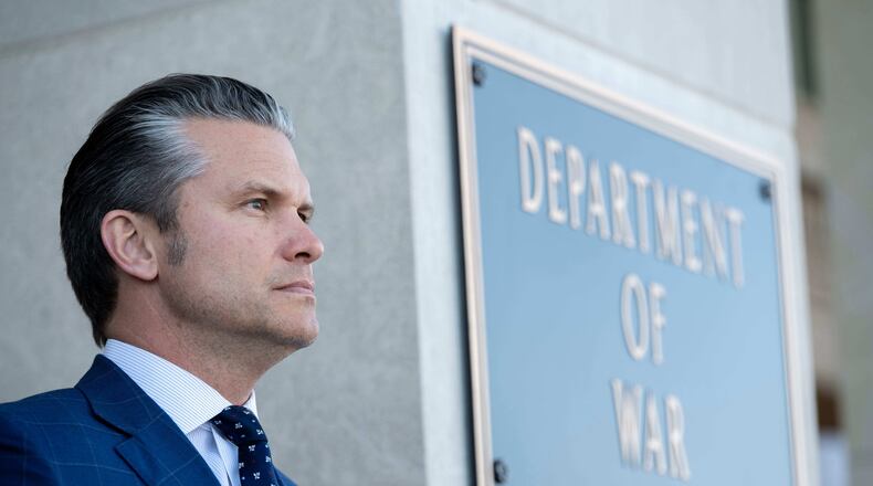 FILE - Defense Secretary Pete Hegseth stands outside the Pentagon during a welcome ceremony for the Japanese defense minister at the Pentagon in Washington, Jan. 15, 2026. (AP Photo/Kevin Wolf, File)