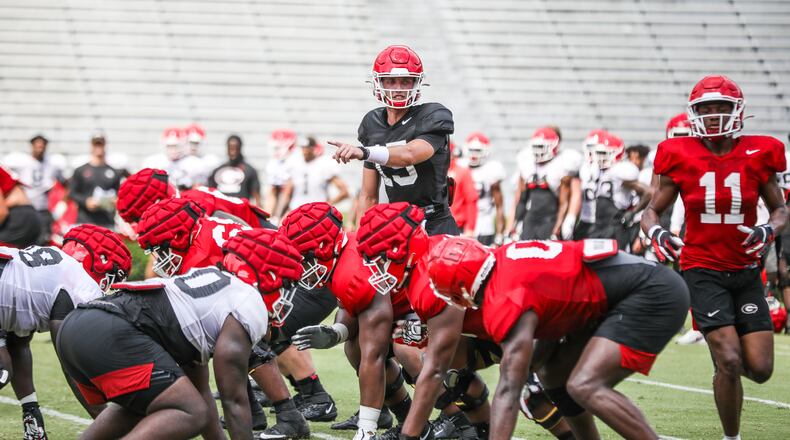 Georgia quarterback Carson Beck (15) signals to his receivers during the Bulldogs’  practice session on Dooley Field at Sanford Stadium this past Tuesday. On Saturday, Beck will try to show Georgia's coaches he deserves to be the primary backup for JT Daniels this season. (Photo by Mackenzie Miles/UGA Athletics)