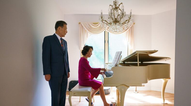 Young Bin Lee, a neuropsychiatrist, stays young by trying to think like a younger person. He is shown here listening as his wife Euli play the piano in their Medford, N.J., home on Monday, Aug. 6, 2018. (Jessica Griffin/Philadelphia Inquirer/TNS)