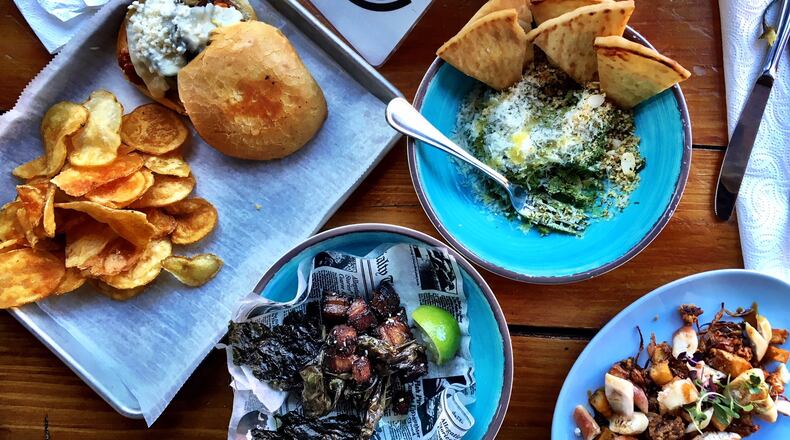 The plates served at Bluetop range from goat sloppy Joes to spinach and kale dip showered in Parmesan cheese. CONTRIBUTED BY WYATT WILLIAMS