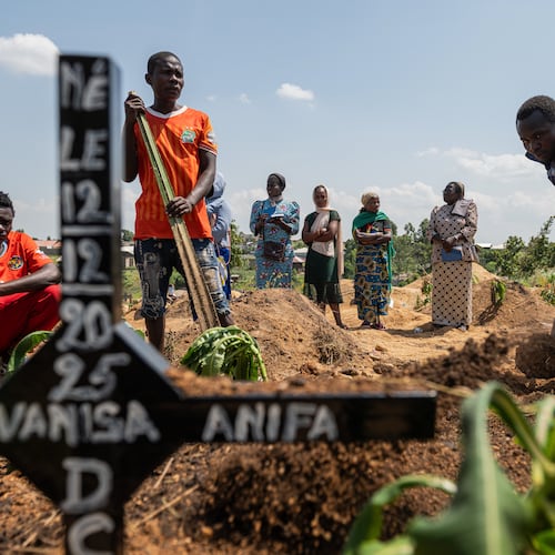 Relatives of Vanisa Anifa, a 6-month-old orphaned girl who died of Ebola, attend her burial, in Bunia, Congo, Friday, June 19, 2026. (AP Photo/Moses Sawasawa)