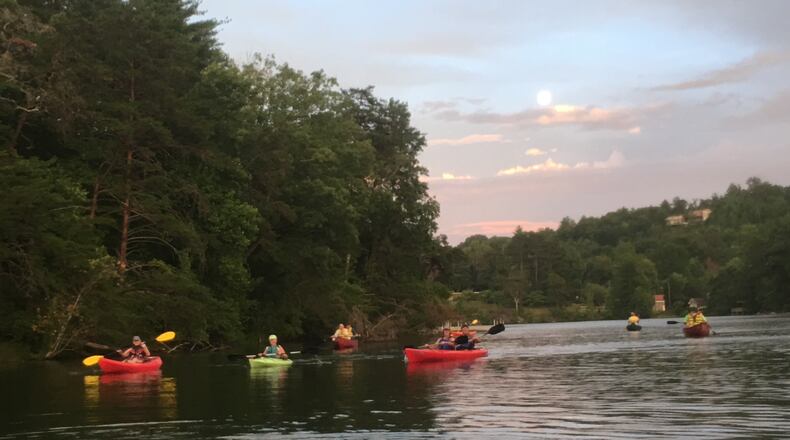 As the sun begins to set, paddlers head out on Tallulah Falls Lake for a 3-mile excursion that ends under the full moon. credit: Joell Zalatan