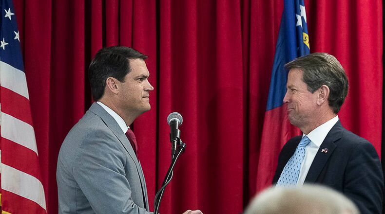 Lieutenant Governor-Elect Geoff Duncan (left) shakes Governor-Elect Brian Kemp’s hand after introducing him during the 31st Biennial Institute for Georgia legislators luncheon at the Georgia Center for Continuing Education last year. Many legislators are waiting to see what education issues they will leave their mark on. (ALYSSA POINTER/ALYSSA.POINTER@AJC.COM)