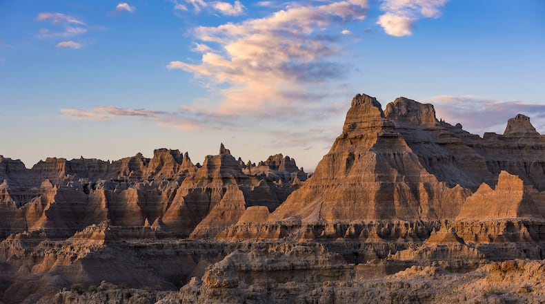 Badlands National Park: This striking South Dakota landscape boasts a maze of buttes, canyons, pinnacles and spires. Skeletons of three-toed horses and saber-toothed cats are among the many fossilized species found here. Wildlife abounds in the park’s 244,000 acres and can often be seen while hiking, camping and traveling the Badlands Loop Scenic Byway. (South Dakota Department of Tourism)