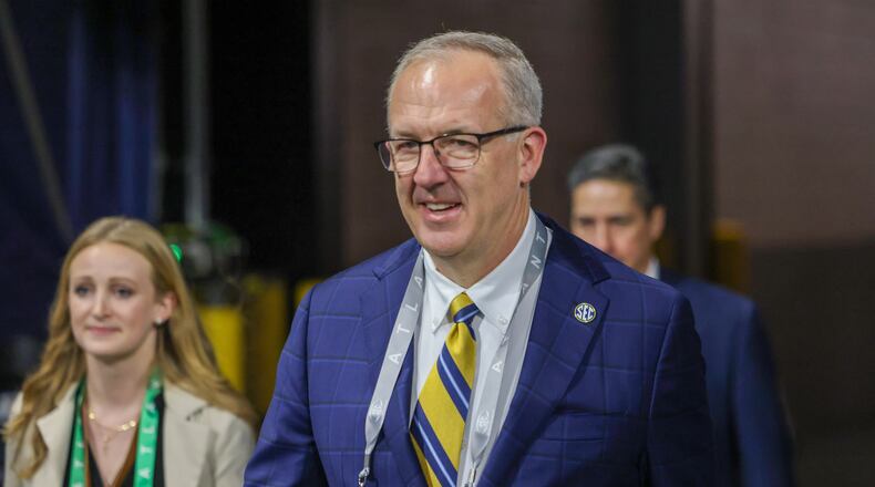SEC Commissioner Greg Sankey walks onto the field during the first half of the SEC Championship football game between the Georgia Bulldogs and the Alabama Crimson Tide at the Mercedes-Benz Stadium in Atlanta, on Saturday, December 2, 2023. (Jason Getz / Jason.Getz@ajc.com)