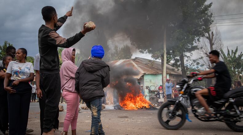 People protest in the streets of Arusha, Tanzania, on election day Wednesday, Oct. 29, 2025. (AP Photo/str)