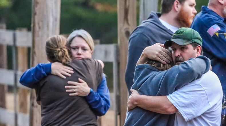 Distraught family members arrived on the scene of a quadruple shooting Thursday in McDonough. JOHN SPINK / JSPINK@AJC.COM