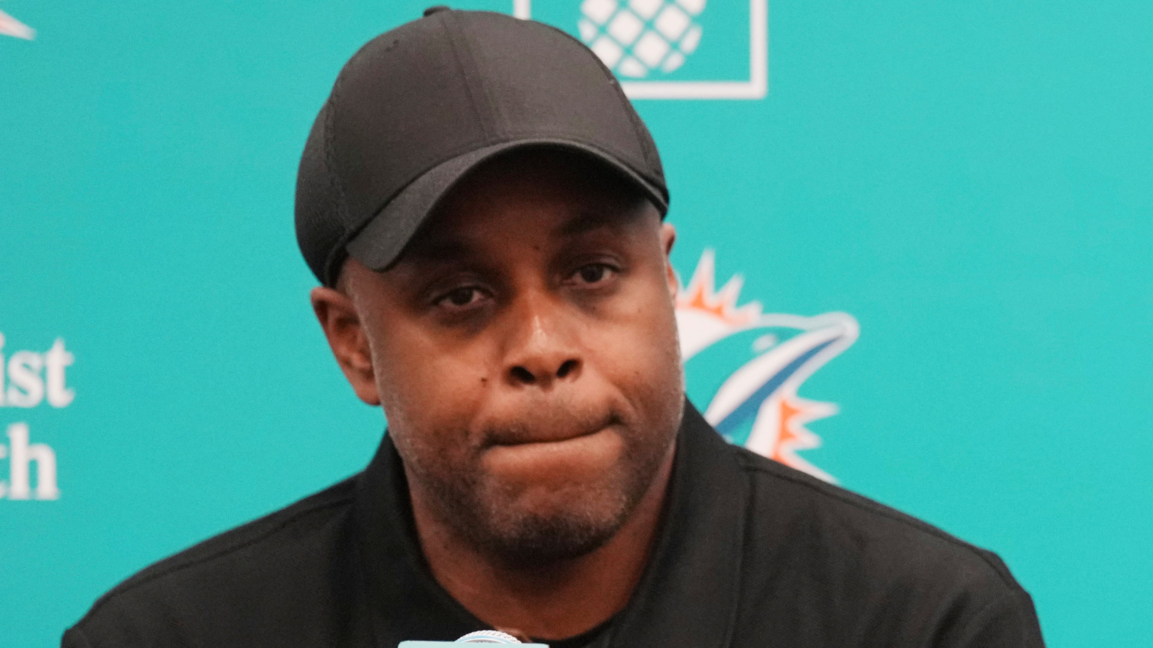 Miami Dolphins general manager Chris Grier listens questions during an NFL football press conference, Friday, April 25, 2025, in Miami Gardens, Fla. (AP Photo/Jim Rassol, File)