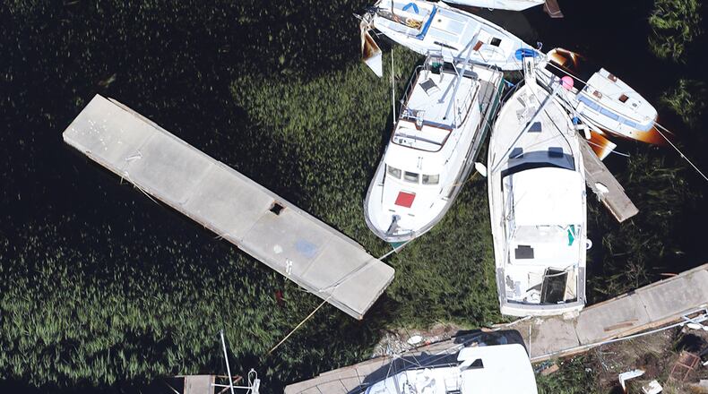 St. Marys: Boats blown away from their docks sit in the marsh after Hurricane Irma on Tuesday at St. Marys on the Georgia coast. Curtis Compton/ccompton@ajc.com