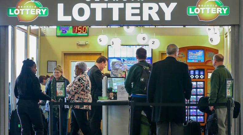 Lines form outside at the Georgia Lottery Airport South Kiosk at Hartsfield-Jackson International Airport for a record-breaking Powerball jackpot.