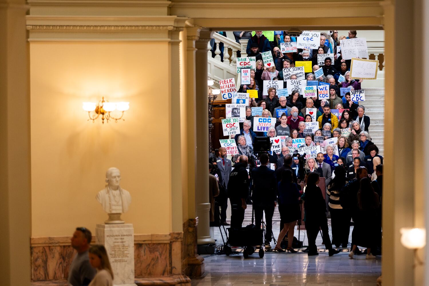 Fired CDC workers join legislator to condemn cuts
