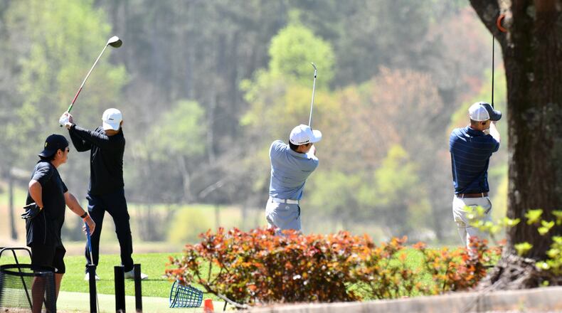 Golfers practices on the driving range at Heritage Golf Links in Tucker on Wednesday, March 25, 2020. For the first time since the crisis began, health officials on Tuesday began reporting the number of people hospitalized with COVID-19, the disease caused by the new virus, across the state. That number was 394 Wednesday, or about 32% of all confirmed COVID-19 cases in Georgia. (Hyosub Shin / Hyosub.Shin@ajc.com)