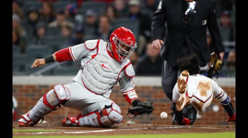 Braves’ Ozzie Albies scores on a sacrifice fly in a 2-1 victory over the Phillies Monday night.