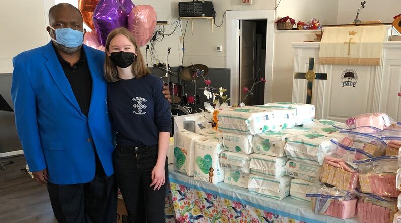 Rachel Everett hosted a charity drive to help single mothers and the homeless. The assembled kits and diapers were delivered to Rev. Clifton E. Dawkins of the True Worship Christian Fellowship Church in Atlanta last weekend. (L-R: Rev. Dawkins and Rachel Everett).