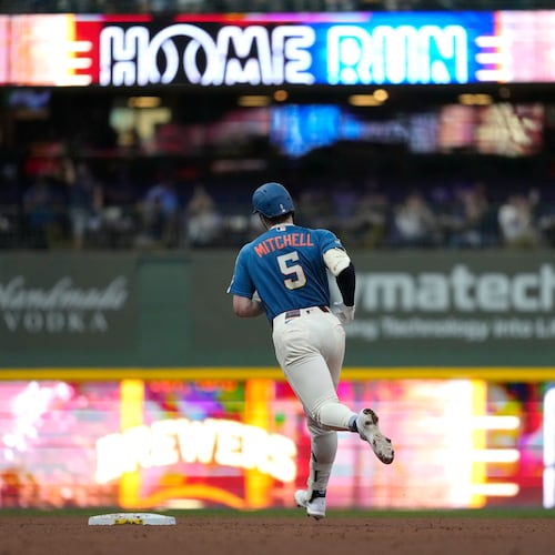 Milwaukee Brewers' Garrett Mitchell rounds the bases after hitting a grand slam during the fifth inning of a baseball game against the Cincinnati Reds, Friday, Sept. 11, 2026, in Milwaukee. (AP Photo/Aaron Gash)