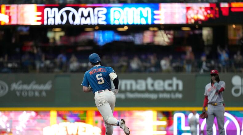 Milwaukee Brewers' Garrett Mitchell rounds the bases after hitting a grand slam during the fifth inning of a baseball game against the Cincinnati Reds, Friday, Sept. 11, 2026, in Milwaukee. (AP Photo/Aaron Gash)