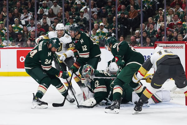 Minnesota Wild goaltender Filip Gustavsson (32) stops the puck against the Vegas Golden Knights during the second period in Game 4 of an NHL hockey Stanley Cup first-round playoff series, Saturday, April 26, 2025, in St. Paul, Minn. (AP Photo/Stacy Bengs)