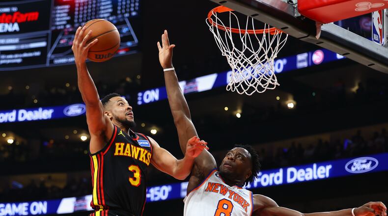 Atlanta Hawks guard CJ McCollum (3) goes up to shoot against New York Knicks forward Og Anunoby (8) during the first half of an NBA basketball game, Monday, April 6, 2026, in Atlanta. (Colin Hubbard/AP)
