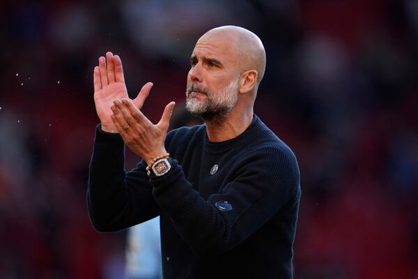 Manchester City's head coach Pep Guardiola leaves the pitch after the English Premier League soccer match between Manchester City and Manchester United in Manchester, England, Sunday, April 6, 2025. (AP Photo/Dave Thompson)