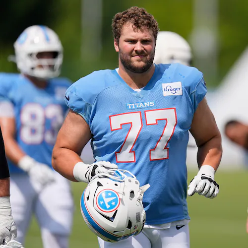 Tennessee Titans guard Peter Skoronski (77) warms up during the NFL football team's training camp Tuesday, Aug. 4, 2026, in Nashville, Tenn. (AP Photo/George Walker IV)