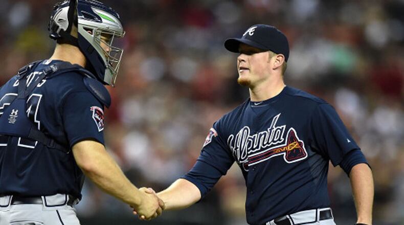 PHOENIX, AZ - JUNE 06: Craig Kimbrel #46 and teammate Evan Gattis #24 of the Atlanta Braves celebrate a 5-2 win against the Arizona Diamondbacks at Chase Field on June 6, 2014 in Phoenix, Arizona. (Photo by Norm Hall/Getty Images)